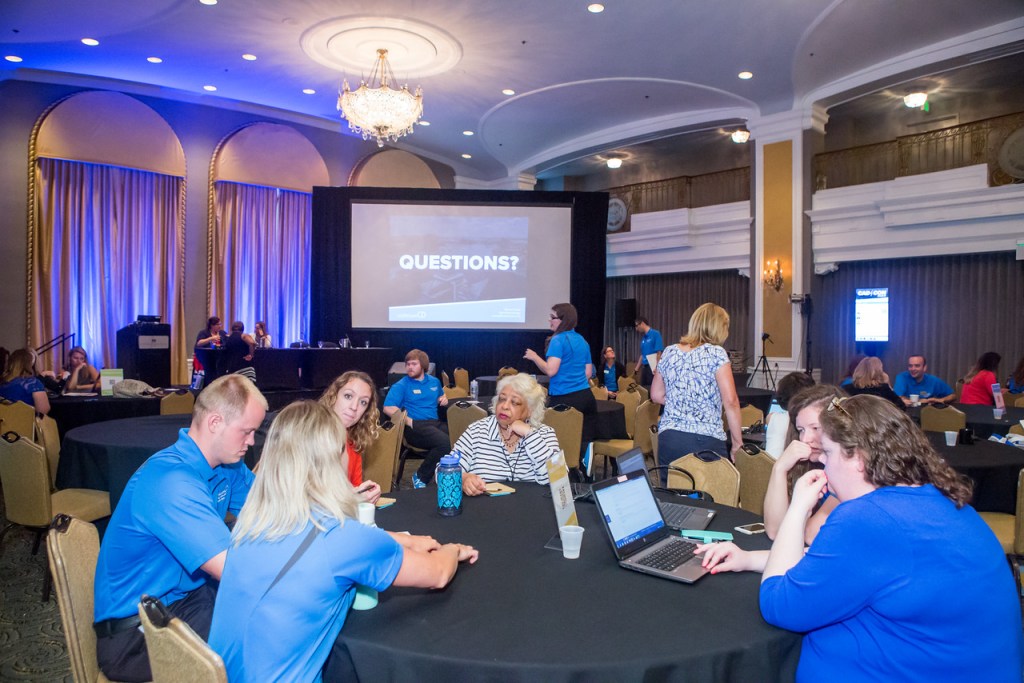 CadmiumCD's Abstract Scorecard Team, Joe Harbach, Amanda Weber, and Traci King, talking with clients about abstract submission software for conference and events.