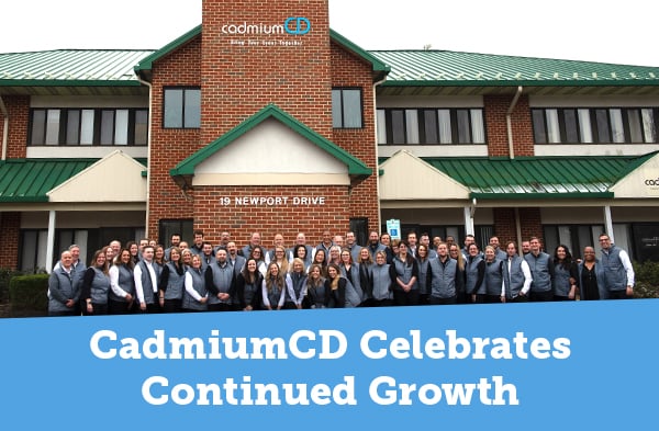 CadmiumCD team celebrating their continued growth in front of the building they now occupy in Forest Hill Maryland