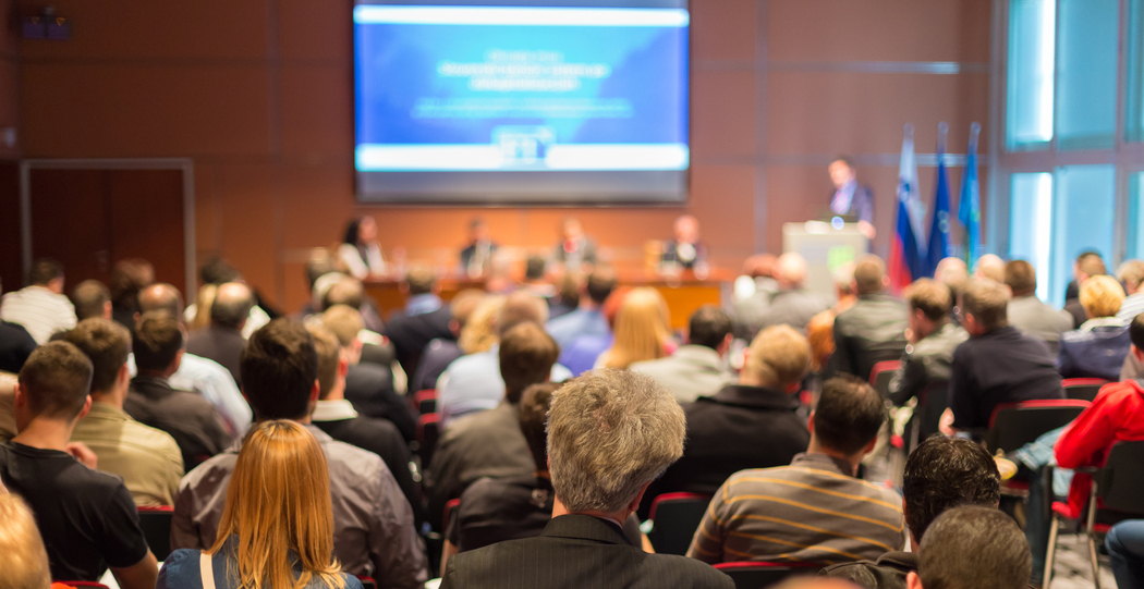 Man public speaking at a conference