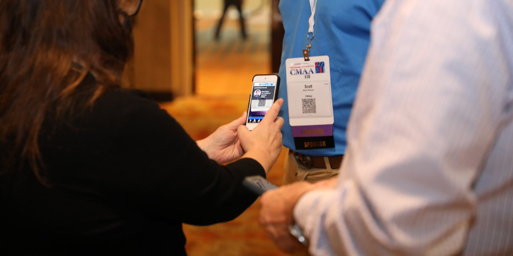 Woman scanning badge with Cadmium Lead Retrieval