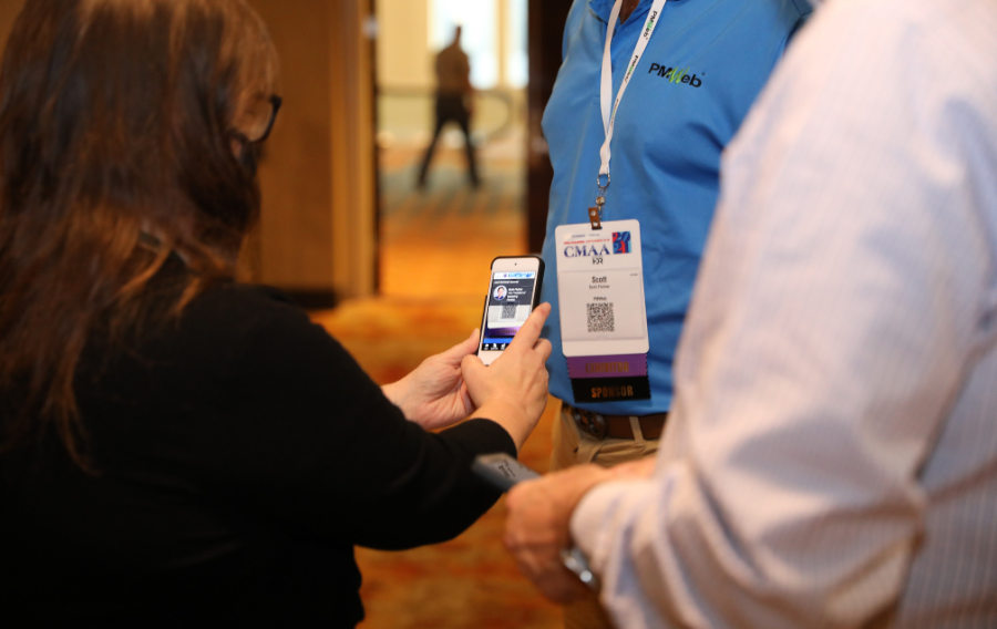 Woman scanning badge at a trade show
