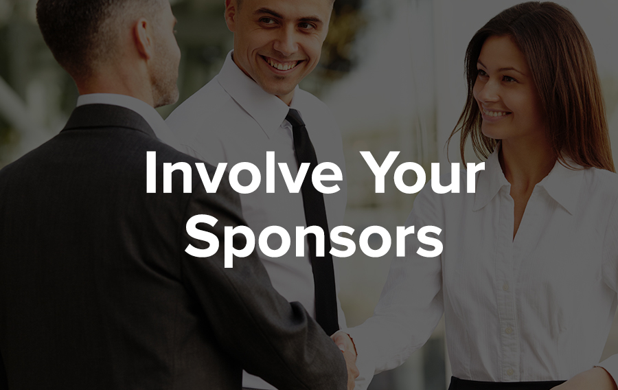 A man in a white button up shirt and black tie introduces another man in a black suit to a woman wearing a white button up blouse. They are meeting planners and sponsors and exhibitors at a conference and are happy to involve each other in their activities.
