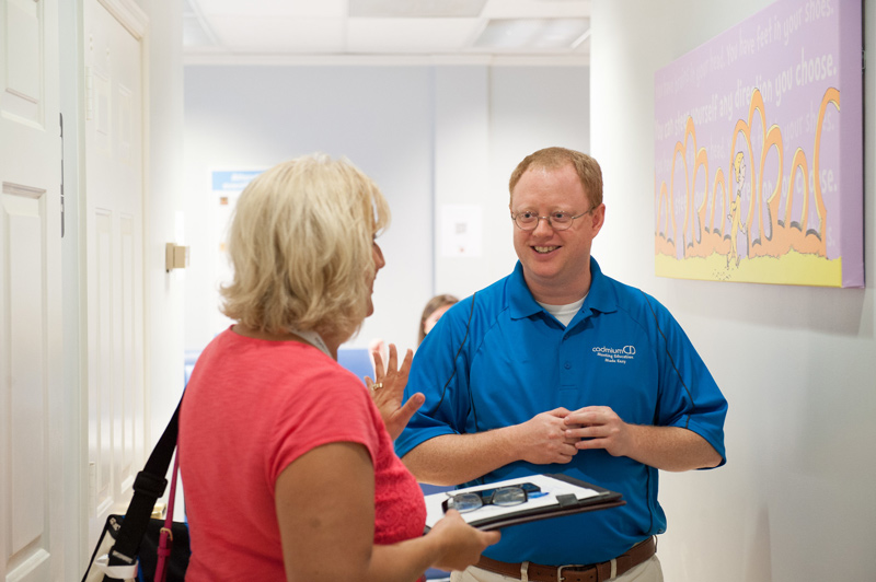 CadmiumCD co-founder Peter Wyatt talking with a client and attendee at CadCon.